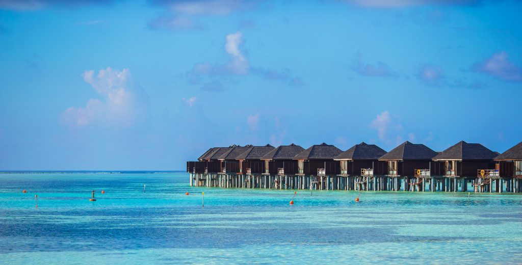 Water bungalows on ideal perfect tropical island