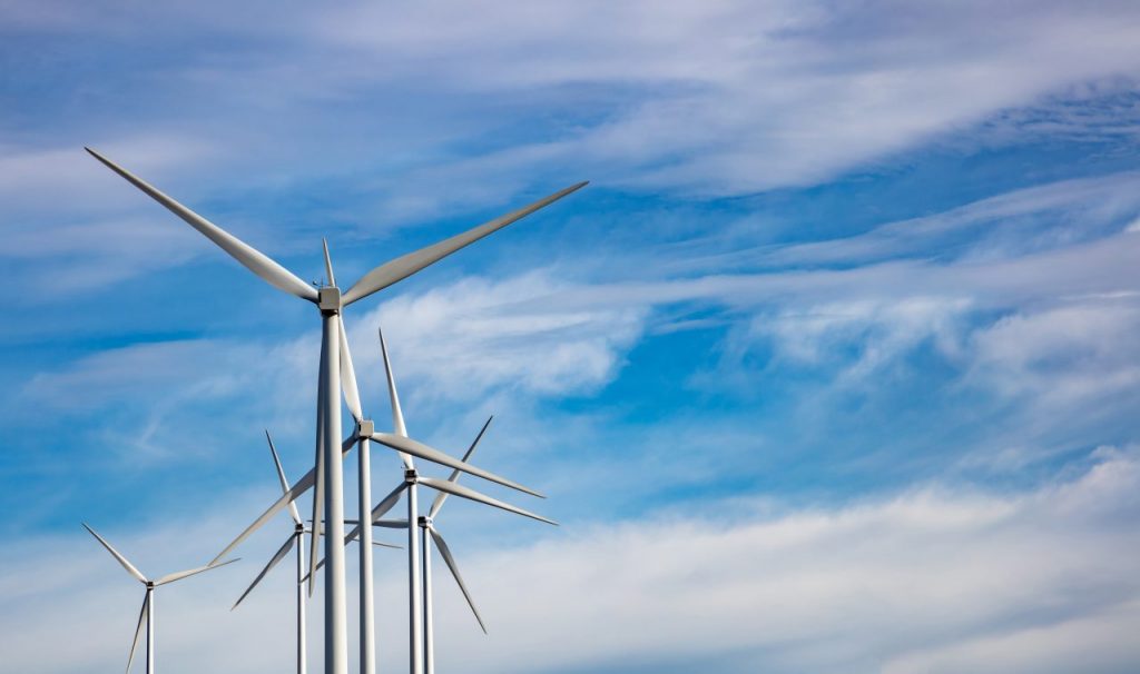 wind-turbines-renewable-energy-on-blue-cloudy-sky--PKJDF8J