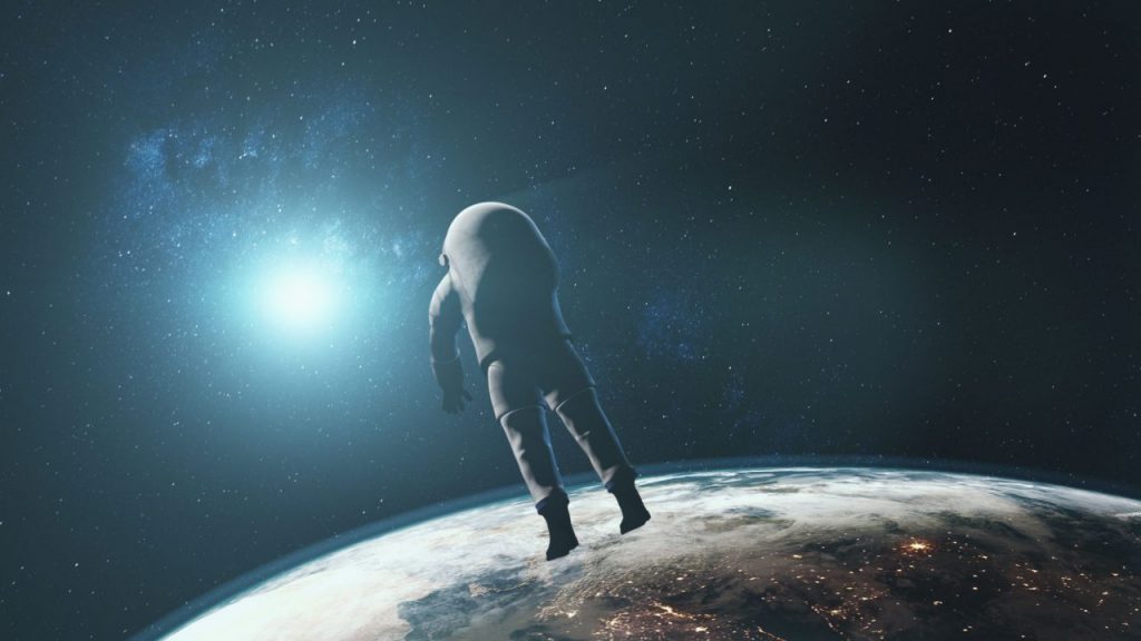 astronaut-against-realistic-planet-earth-starlight-88L6KDQ