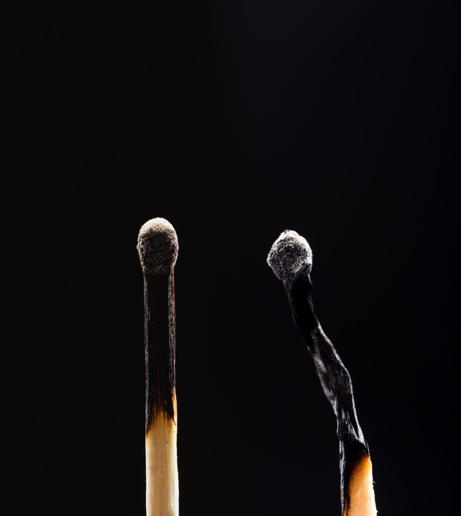 two-burned-out-wooden-matches-on-black-P5Y23QF